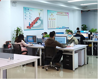En grupp människor som arbetar vid skrivbord på ett kontor, anställd av en tillverkare av skönhetsutrustning.