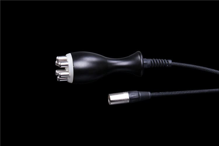 A black cable connected to a black background with the Slimming Beauty 6 in 1 Body Contouring Machine.