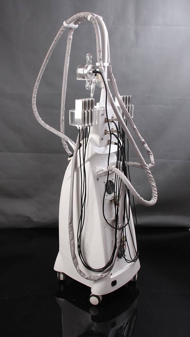 Eine weiße Multifunktions-Schönheitsbehandlung mit Kavitation-Vakuumwalze Ems Velasmooth-Maschine mit daran befestigtem Draht, die auf multifunktionale Schönheitsbehandlungen spezialisiert ist.