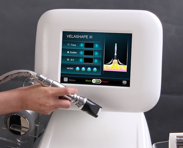 A person is using the Beauty Wholesale Vela Cellulite Velasmooth Treatment Equipment machine to get rid of wrinkles.