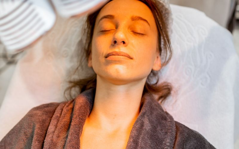 Relaxing facial treatment with comfortable pillow, highlighting skin rejuvenation and wellness.