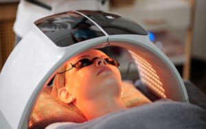 Cosmetic light therapy device for skin rejuvenation, facial treatment at a spa or clinic.