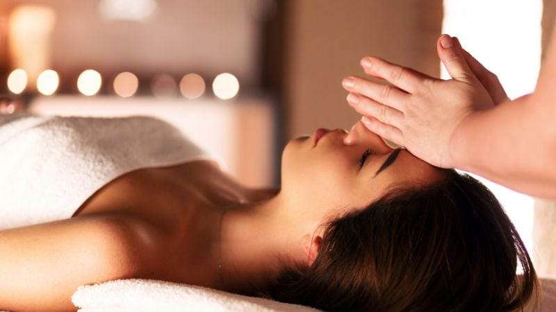 Calm woman receiving a relaxing facial massage during a spa treatment for ultimate comfort and stress relief.