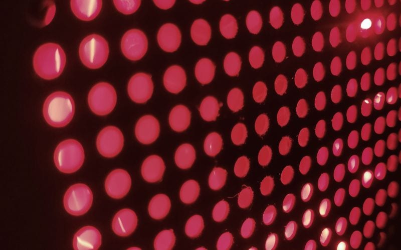 Red glowing LED light panel creating a cozy, modern ambiance for home relaxation and comfort. Perfect for enhancing interior decor with warm, inviting lighting.