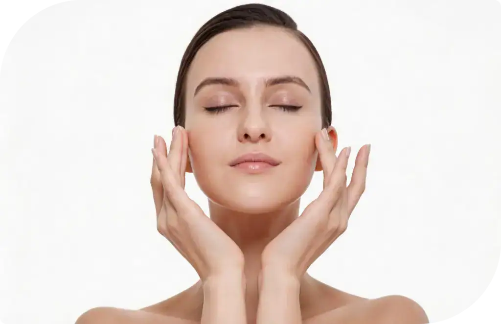 Close-up of a woman with clear skin gently touching her face, demonstrating skincare and facial care routine.