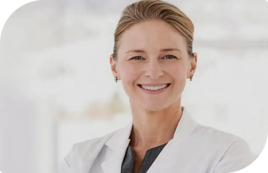Smiling professional woman in white lab coat, representing healthcare or scientific expertise, with a bright, clean background.