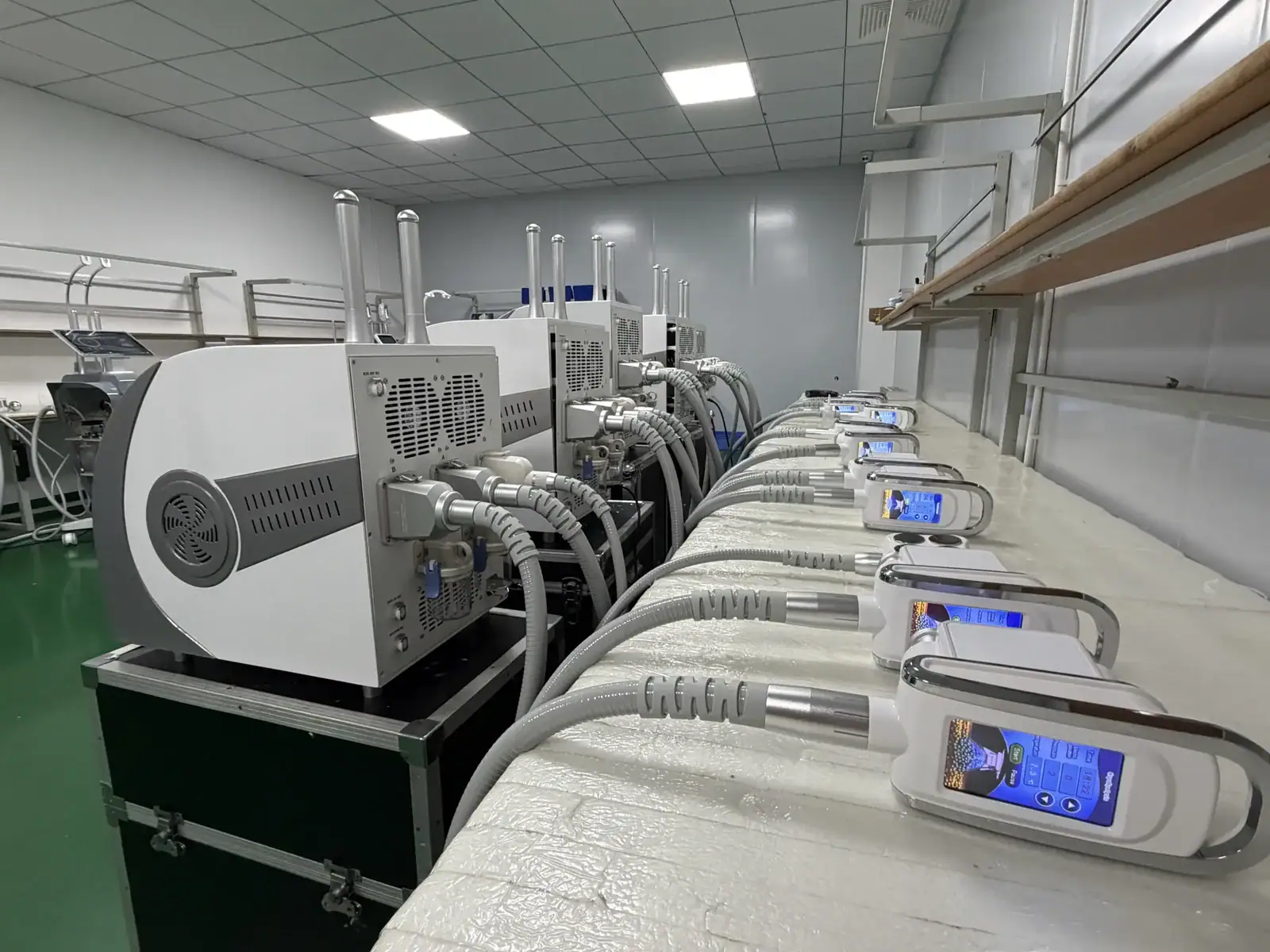 Line of modern medical devices with digital screens in a clean, well-lit laboratory setting at Osano.